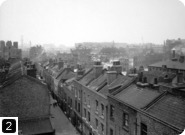View of Prusom Street, Stepney, before slum clearance for Wapping Estate, 1925. From the London Metropolitan Archives Photograph Library. Ref SC/PHL/02/ 0735. Copyright City of London: London Metropolitan Archives. Not to be reused without permission.